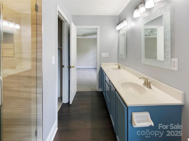 10406 Baskerville Ave, Charlotte, NC 28269 - bathroom with baseboards, tiled shower, and double vanity