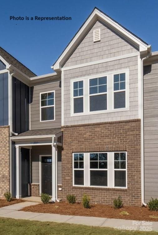 view of front of home featuring brick siding