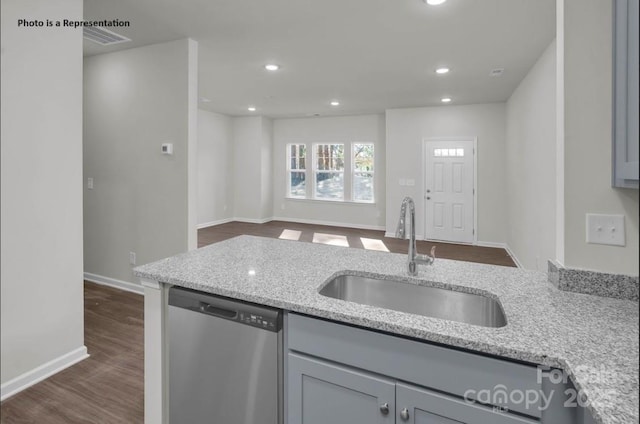 kitchen with dishwasher, a sink, gray cabinets, light stone countertops, and recessed lighting