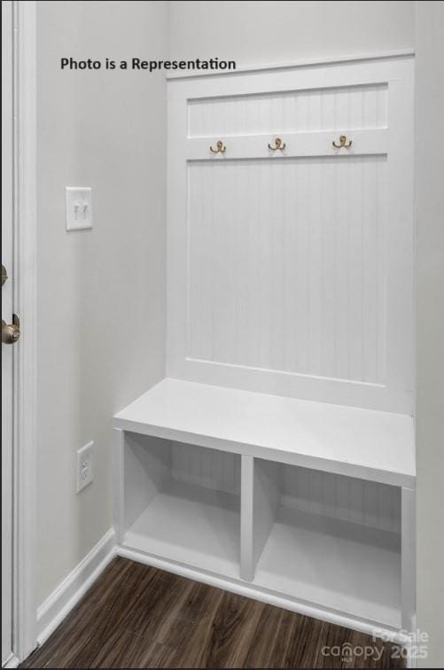 mudroom featuring dark wood-style flooring and baseboards