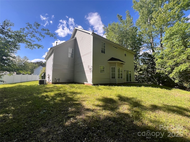 rear view of property with cooling unit