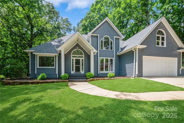 26056 Neptunes Lndg, Fort Mill, SC 29708 - view of front of house with driveway, a shingled roof, a front yard, and an attached garage