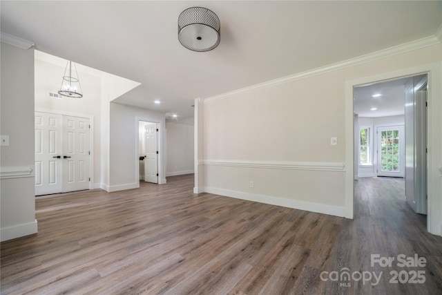 26056 Neptunes Lndg, Fort Mill, SC 29708 - empty room featuring wood finished floors, baseboards, recessed lighting, a chandelier, and crown molding