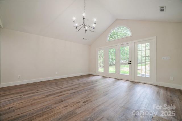 26056 Neptunes Lndg, Fort Mill, SC 29708 - unfurnished dining area with a chandelier, high vaulted ceiling, wood finished floors, and baseboards