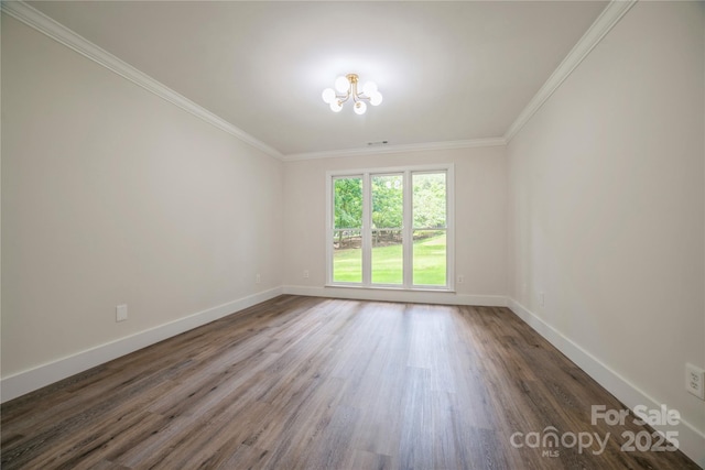 26056 Neptunes Lndg, Fort Mill, SC 29708 - spare room with a chandelier, ornamental molding, wood finished floors, and baseboards