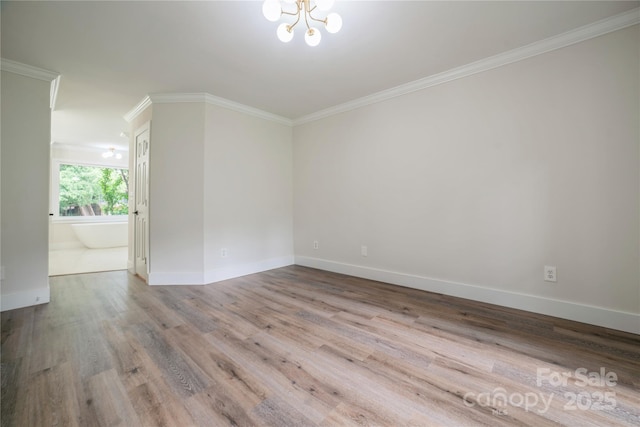 26056 Neptunes Lndg, Fort Mill, SC 29708 - spare room with a chandelier, wood finished floors, ornamental molding, and baseboards