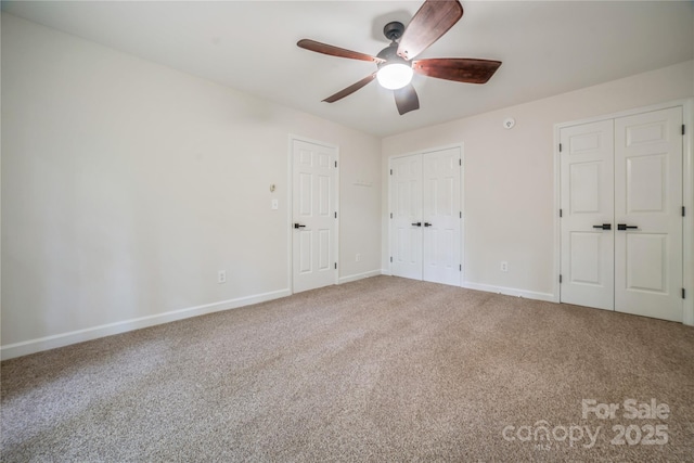 26056 Neptunes Lndg, Fort Mill, SC 29708 - unfurnished bedroom with multiple closets, carpet flooring, baseboards, and ceiling fan