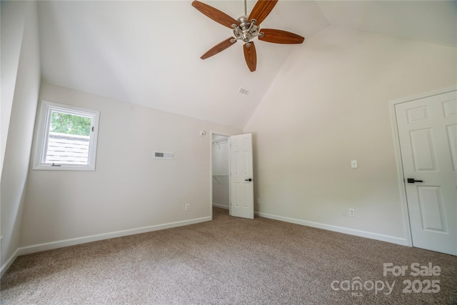 26056 Neptunes Lndg, Fort Mill, SC 29708 - unfurnished bedroom with carpet, a walk in closet, baseboards, high vaulted ceiling, and ceiling fan
