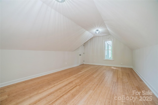 26056 Neptunes Lndg, Fort Mill, SC 29708 - additional living space featuring light wood-style flooring, lofted ceiling, and baseboards