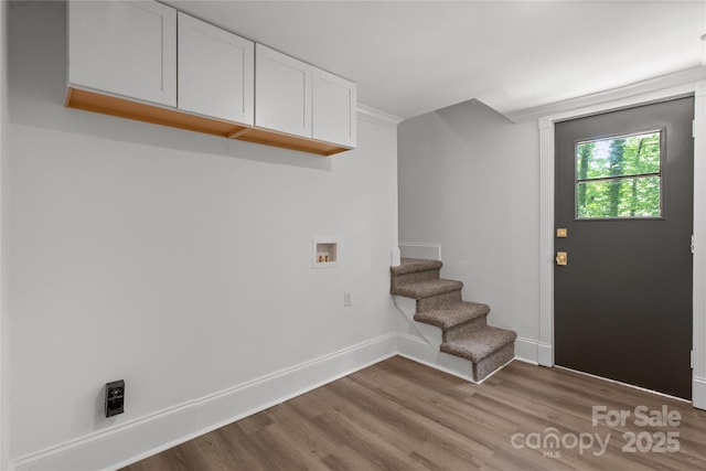entryway featuring wood finished floors and baseboards