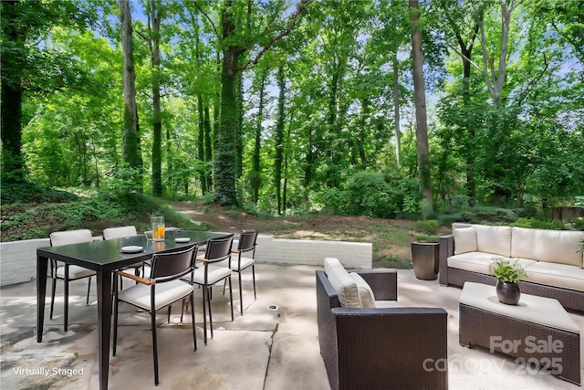 view of patio featuring outdoor dining area and an outdoor living space