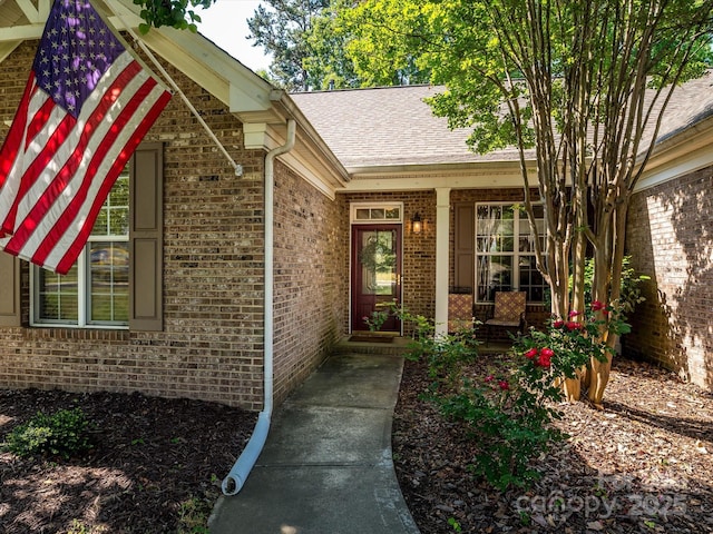 14336 Northridge Dr, Charlotte, NC 28269 - view of exterior entry with brick siding and a shingled roof