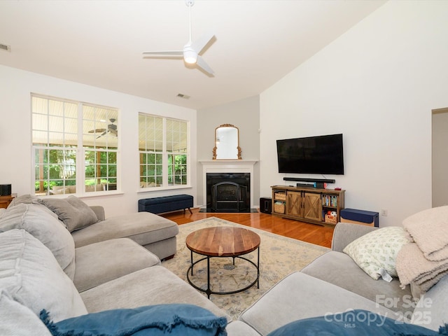 14336 Northridge Dr, Charlotte, NC 28269 - living area featuring a ceiling fan, wood finished floors, a fireplace, and lofted ceiling