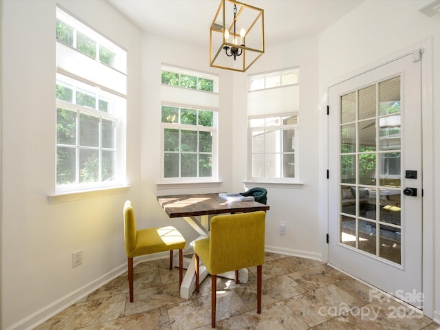 14336 Northridge Dr, Charlotte, NC 28269 - sunroom featuring healthy amount of natural light and a chandelier