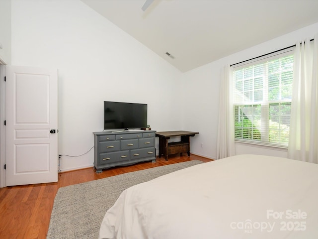 14336 Northridge Dr, Charlotte, NC 28269 - bedroom featuring light wood finished floors, high vaulted ceiling, and ceiling fan