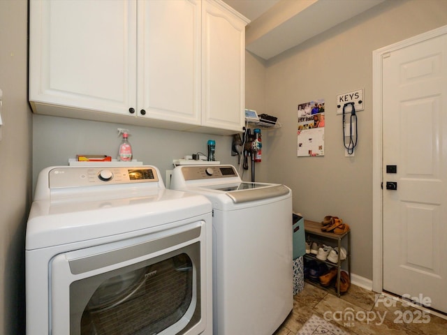 14336 Northridge Dr, Charlotte, NC 28269 - washroom featuring cabinet space, washing machine and clothes dryer, baseboards, and light tile patterned flooring