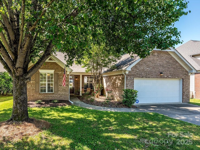 14336 Northridge Dr, Charlotte, NC 28269 - view of front facade with driveway, a garage, brick siding, a front lawn, and roof with shingles