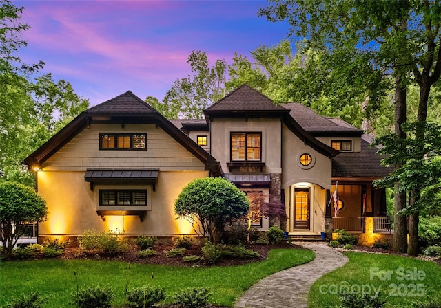 8534 Highgrove St, Charlotte, NC 28277 - view of front of property featuring stucco siding, a front lawn, a standing seam roof, and a porch