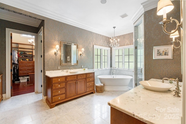 8534 Highgrove St, Charlotte, NC 28277 - bathroom with a chandelier, ornamental molding, vanity, a spacious closet, and a soaking tub