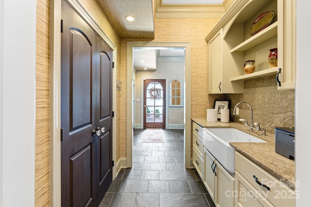 8534 Highgrove St, Charlotte, NC 28277 - kitchen with ornamental molding, a sink, open shelves, stone tile flooring, and light stone countertops