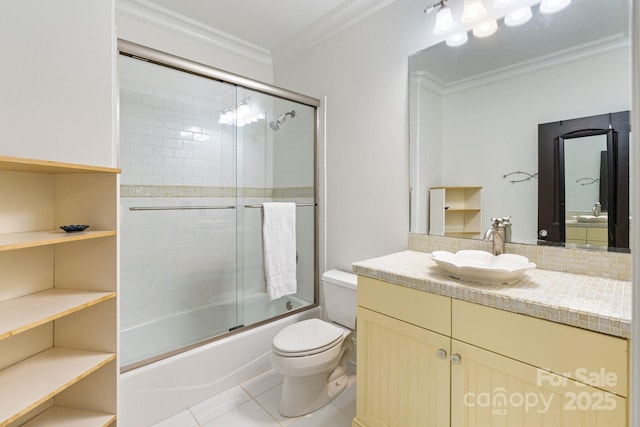 8534 Highgrove St, Charlotte, NC 28277 - full bath with crown molding, toilet, tile patterned floors, bath / shower combo with glass door, and decorative backsplash