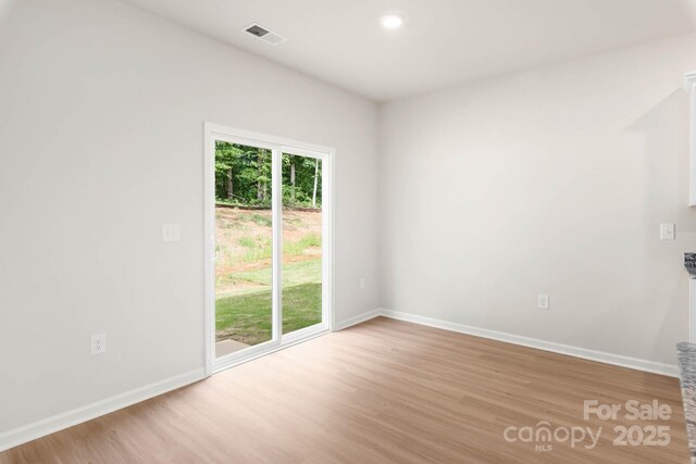 3334 Strong Box Ln, Gastonia, NC 28052 - spare room featuring light wood-style floors, baseboards, and recessed lighting