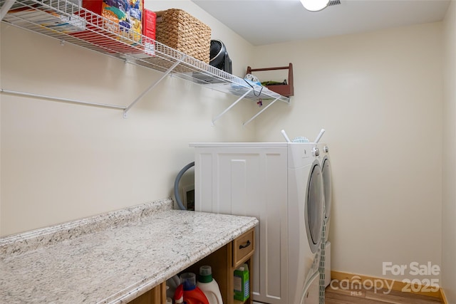 14 N Main St Unit 1 & 2, Waynesville, NC 28786 - clothes washing area with washing machine and clothes dryer, wood finished floors, and baseboards