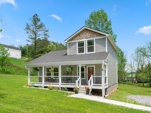 9 Ruff Rd, Leicester, NC 28748 - view of front of house featuring a porch, a front lawn, crawl space, and a shingled roof