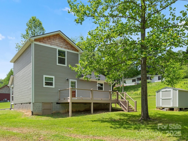 9 Ruff Rd, Leicester, NC 28748 - rear view of house featuring a storage unit, a deck, a lawn, and crawl space