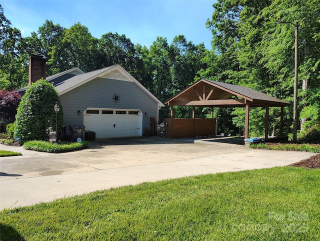322 Killian Rd, Stanley, NC 28164 - view of side of property with a carport, a chimney, concrete driveway, and a yard