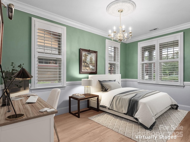5 Holland Mountain Vw, Asheville, NC 28804 - bedroom with a chandelier, ornamental molding, light wood-style floors, and baseboards