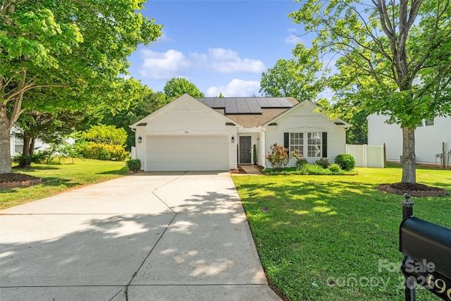 1961 Leesburg Dr, Clover, SC 29710 - view of front of house featuring a garage, concrete driveway, and roof mounted solar panels
