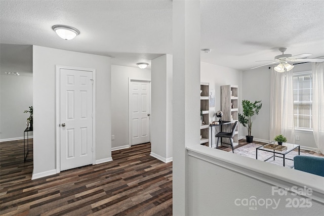 1961 Leesburg Dr, Clover, SC 29710 - corridor featuring a textured ceiling, dark wood-style floors, and baseboards
