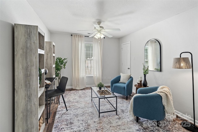1961 Leesburg Dr, Clover, SC 29710 - living area with a ceiling fan, baseboards, wood finished floors, and a textured ceiling
