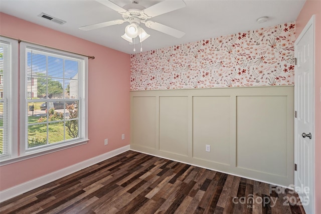 1961 Leesburg Dr, Clover, SC 29710 - empty room with wallpapered walls, dark wood-type flooring, a wainscoted wall, a decorative wall, and baseboards