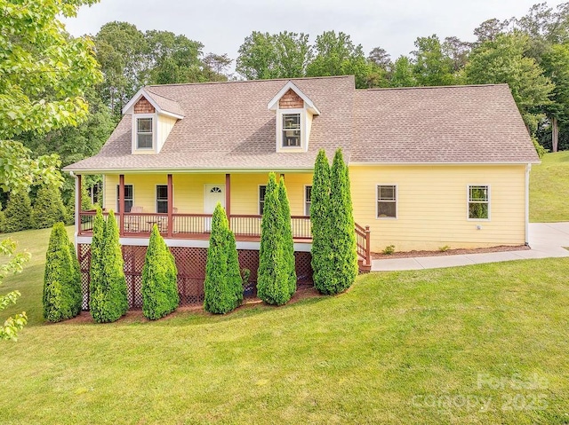 104 Bobby Ridge Dr, Leicester, NC 28748 - cape cod-style house featuring a front yard, covered porch, and a shingled roof