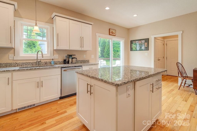 104 Bobby Ridge Dr, Leicester, NC 28748 - kitchen featuring dishwasher, a sink, plenty of natural light, light wood-style floors, and recessed lighting