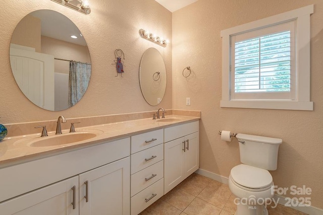 104 Bobby Ridge Dr, Leicester, NC 28748 - bathroom with double vanity, tile patterned floors, toilet, baseboards, and a textured wall