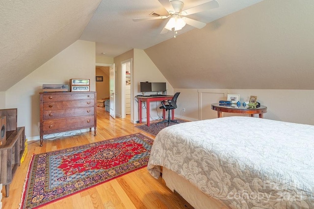 104 Bobby Ridge Dr, Leicester, NC 28748 - bedroom with wood finished floors, vaulted ceiling, a ceiling fan, a textured ceiling, and baseboards