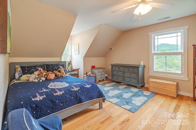 104 Bobby Ridge Dr, Leicester, NC 28748 - bedroom with wood finished floors, baseboards, ceiling fan, and lofted ceiling
