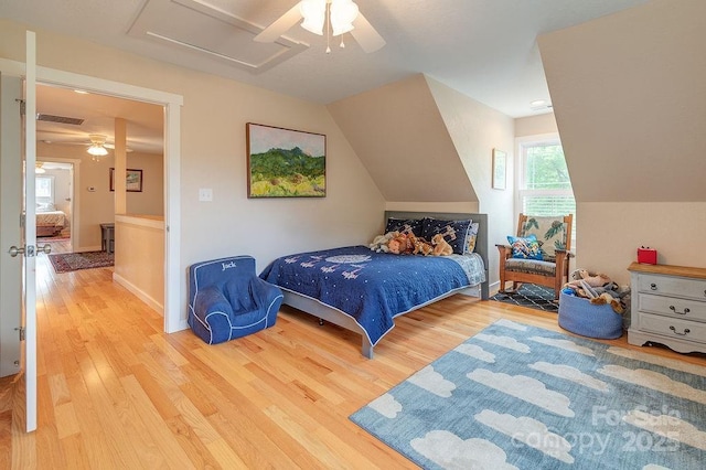 104 Bobby Ridge Dr, Leicester, NC 28748 - bedroom featuring wood finished floors, ceiling fan, attic access, and lofted ceiling