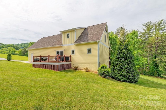 104 Bobby Ridge Dr, Leicester, NC 28748 - back of house with board and batten siding, a deck, a yard, and roof with shingles
