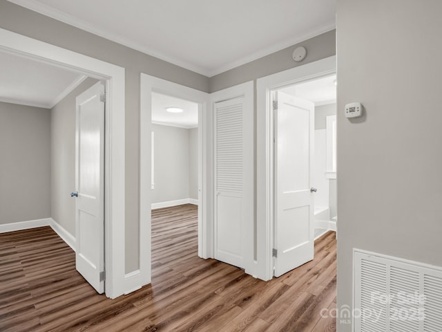 411 W Sycamore St, Lincolnton, NC 28092 - corridor with wood finished floors, crown molding, and baseboards
