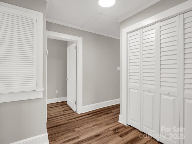 411 W Sycamore St, Lincolnton, NC 28092 - corridor featuring wood finished floors, baseboards, crown molding, and attic access