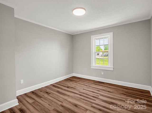 411 W Sycamore St, Lincolnton, NC 28092 - empty room with ornamental molding, wood finished floors, and baseboards