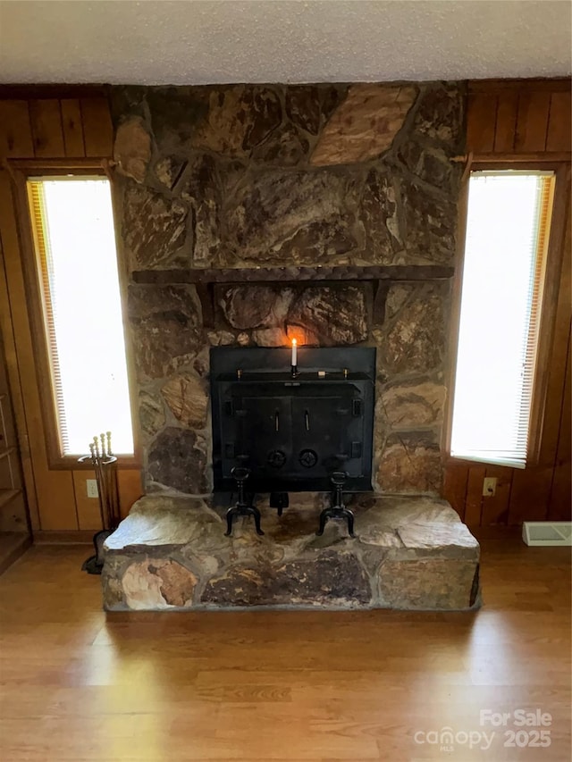 947 Ravendale Dr, Charlotte, NC 28216 - detailed view of a wood stove and wood finished floors