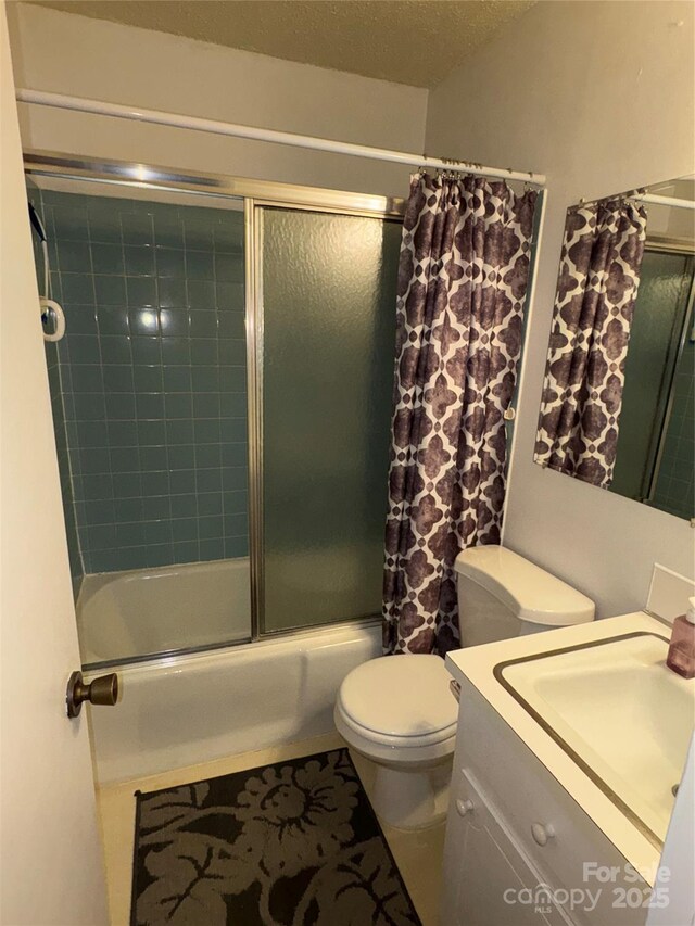 947 Ravendale Dr, Charlotte, NC 28216 - bathroom with combined bath / shower with glass door, toilet, and vanity