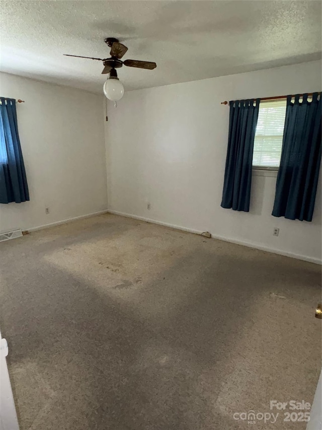 947 Ravendale Dr, Charlotte, NC 28216 - unfurnished room with ceiling fan, a textured ceiling, carpet flooring, and baseboards