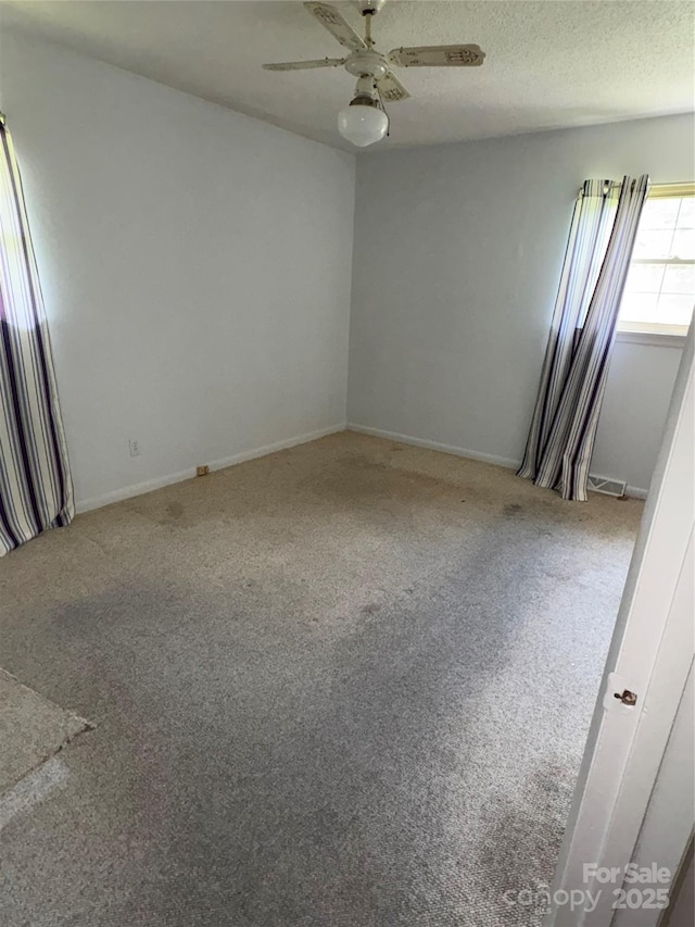 947 Ravendale Dr, Charlotte, NC 28216 - carpeted empty room with ceiling fan and baseboards