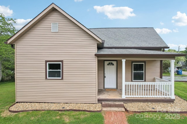 view of front of home featuring a porch and a shingled roof